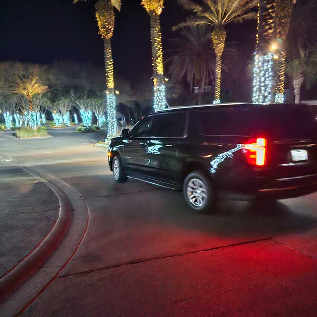 Ford expedition pulling out of driveway at night